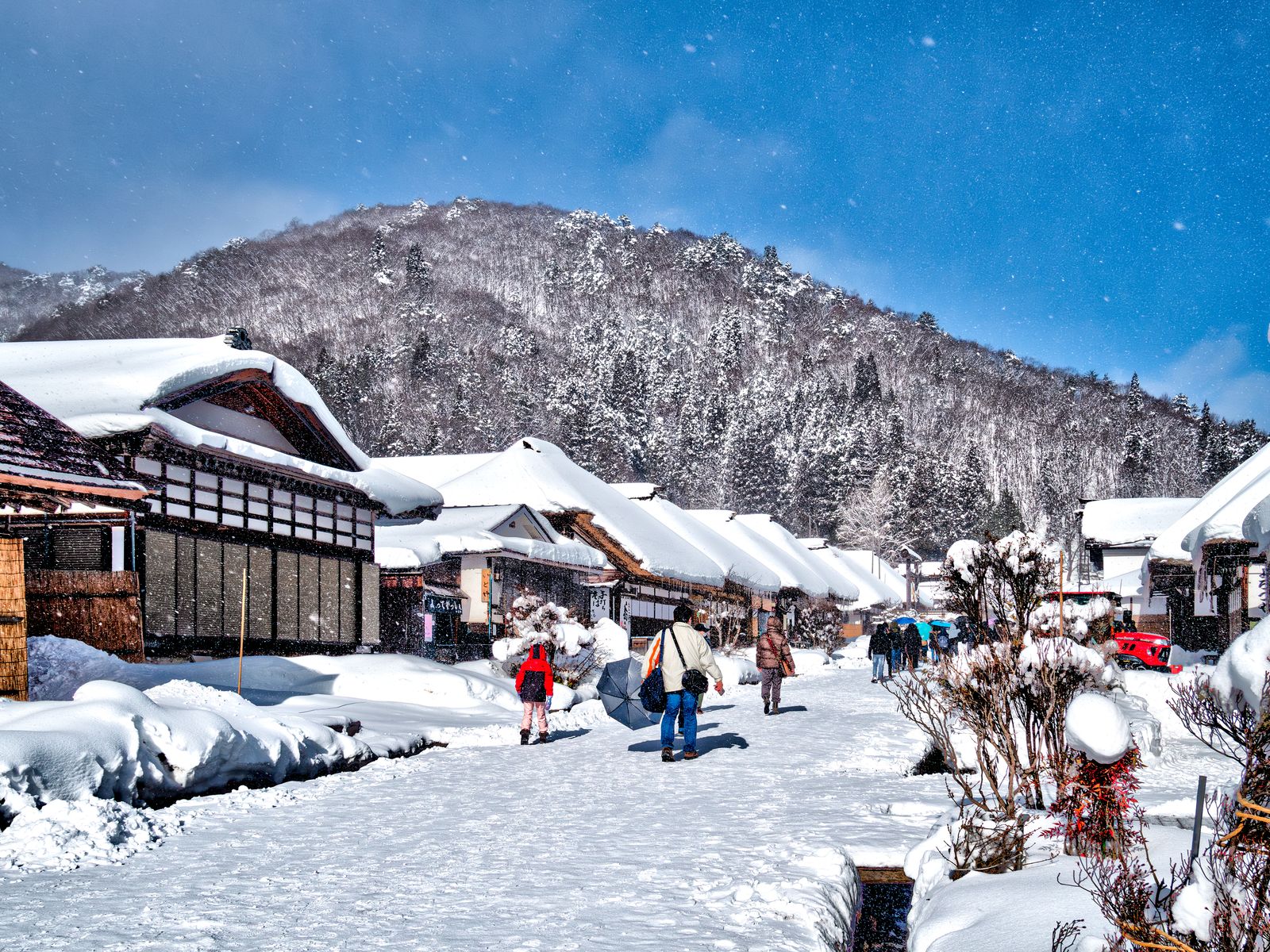 Snow-covered thatched inns along the main street of Ouchijuku post town, Fukushima