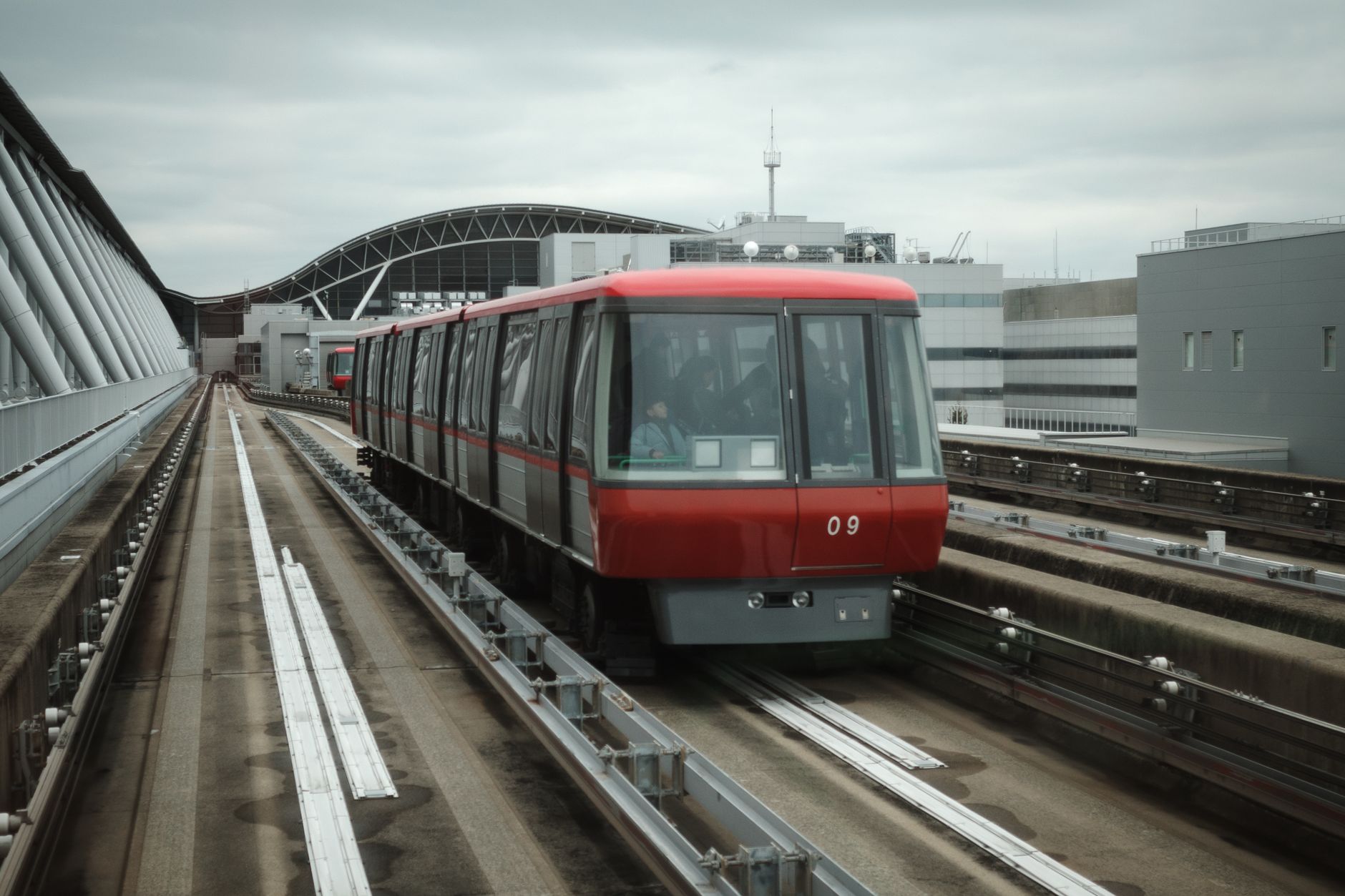 The Osaka Monorail arriving at a station