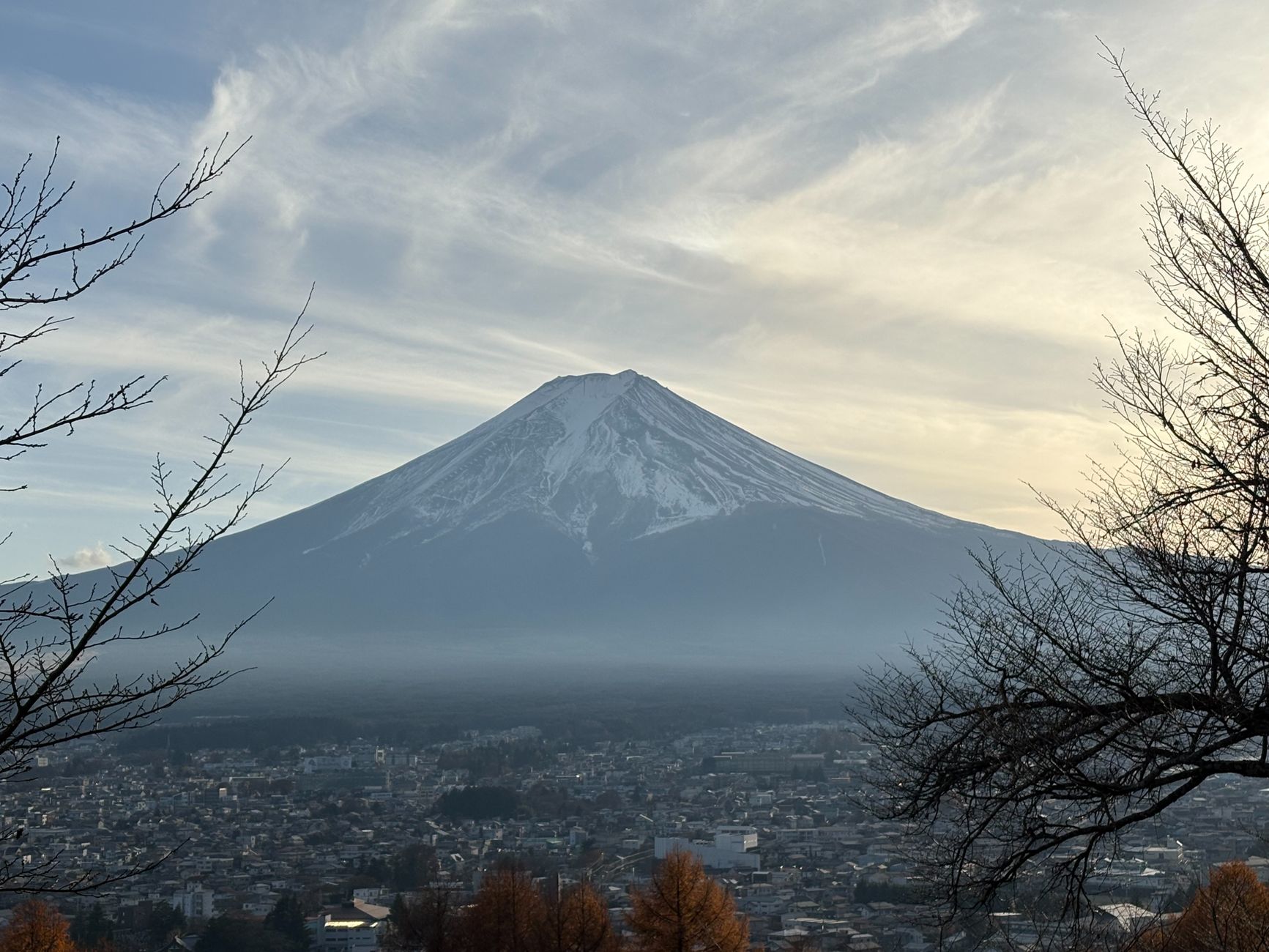 Snow-capped Mount Fuji rising above Fujiyoshida, the town at its foot where Fuji-Q Highland stands