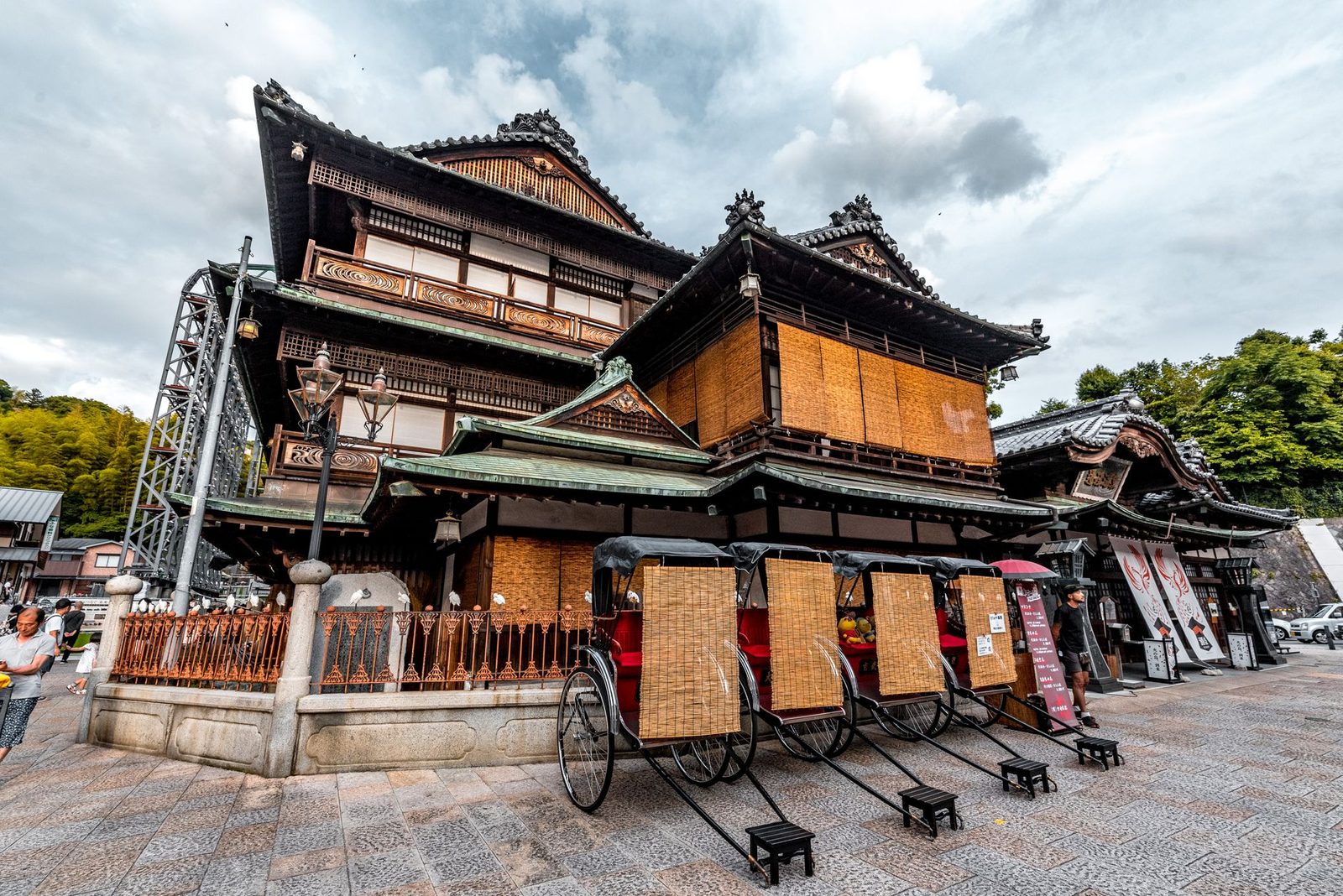 Illustrative photo: Charming Japanese building with rickshaws in front, showcasing traditional architecture.