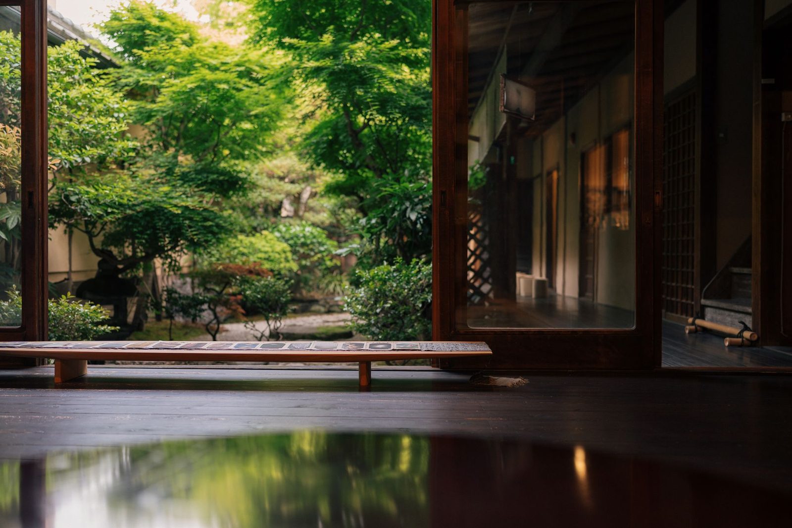 Illustrative photo: A tranquil view of a Japanese garden seen through a traditional house in Kyoto, Japan.