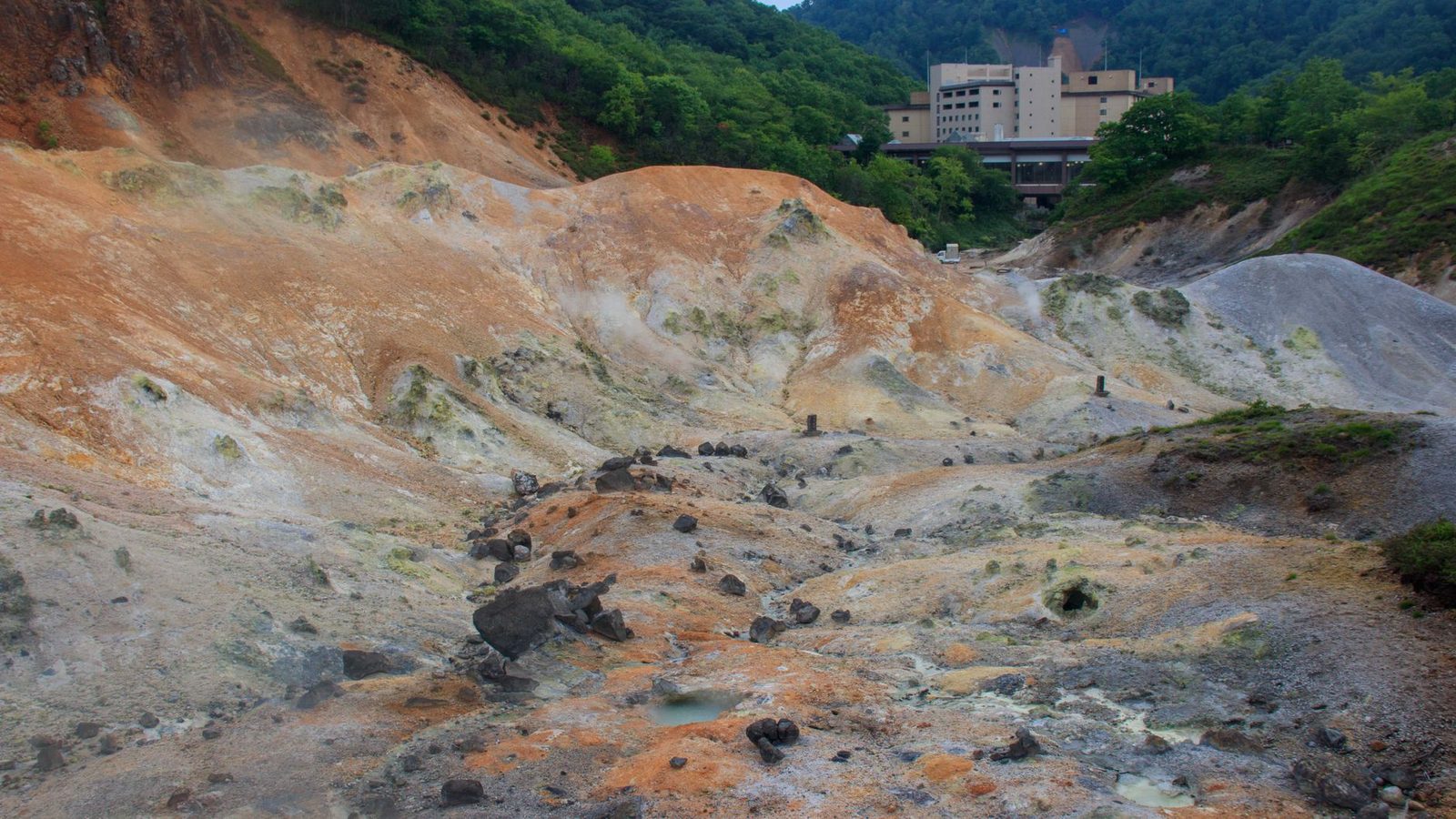 Illustrative photo: A rugged geothermal landscape with steam vents in Noboribetsu, Japan.