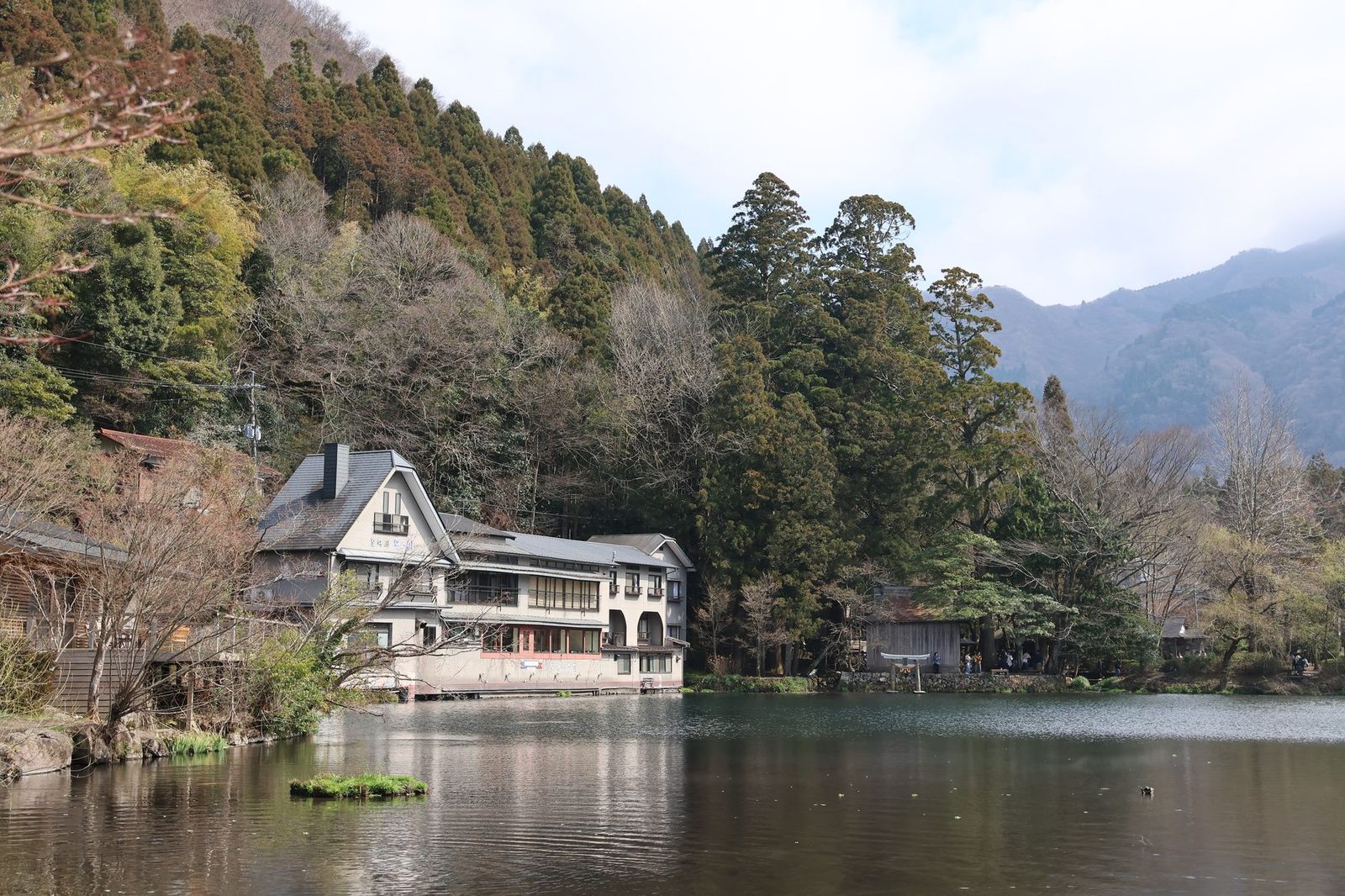 Illustrative photo: Beautiful lakeside scenery featuring traditional building and lush forest.